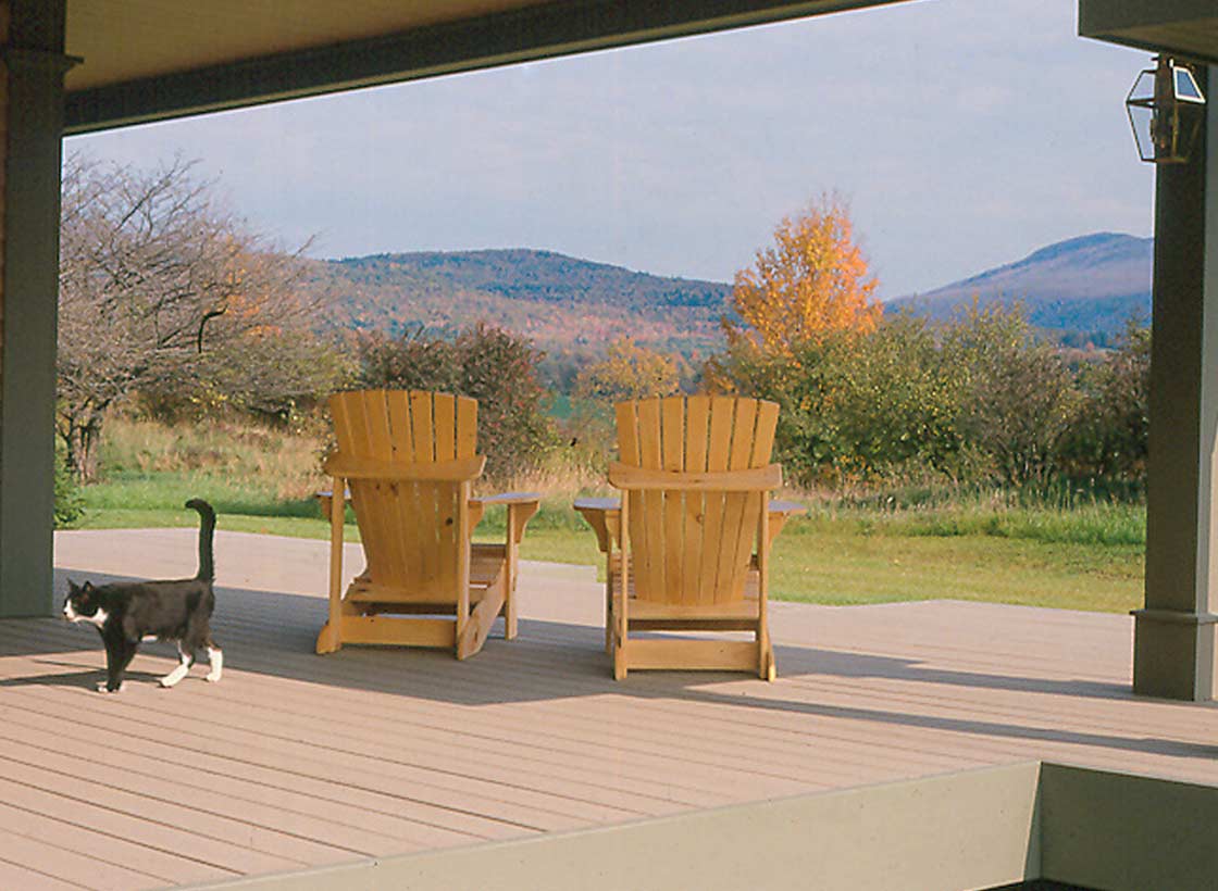 Modern Farm House and Barn Deck, Cat and Chairs